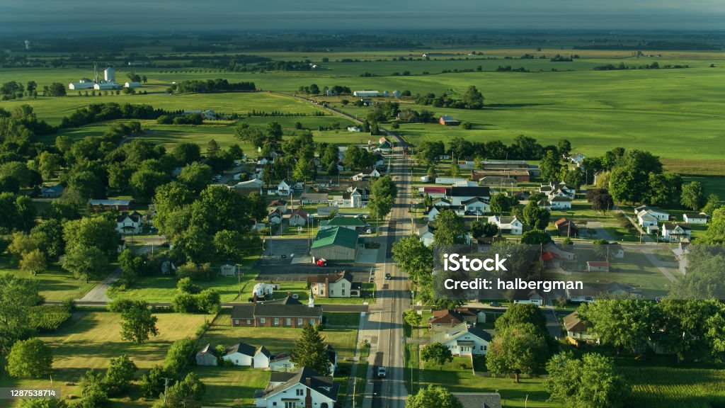 Main Street Running Through Small Ohio Town - Aerial Drone shot of farmland in Madison County, Ohio and the small town of Mount Sterling on a sunny morning in summer. Rural Scene Stock Photo