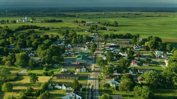 Main Street Running Through Small Ohio Town - Aerial Drone shot of farmland in Madison County, Ohio and the small town of Mount Sterling on a sunny morning in summer. rural scene stock pictures, royalty-free photos & images