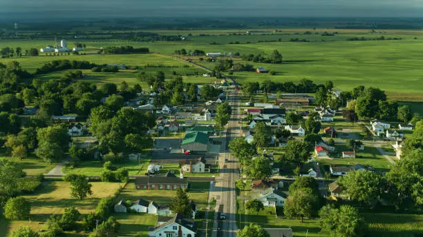 Drone shot of farmland in Madison County, Ohio and the small town of Mount Sterling on a sunny morning in summer.