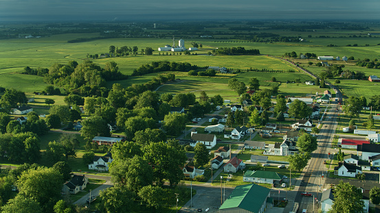 Drone shot of farmland in Madison County, Ohio and the small town of Mount Sterling on a sunny morning in summer.