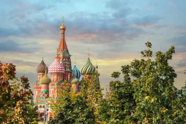 Photo of view of Saint Basil's Cathedral in the morning, Red Square, Moscow, Russia. through the green trees