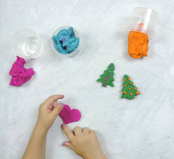 istock colored mass for modeling, decorative dough for children's creativity, baby made a heart 1287545744