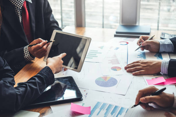 istock Investor group analyze information report financial graph at the meeting 1287546458