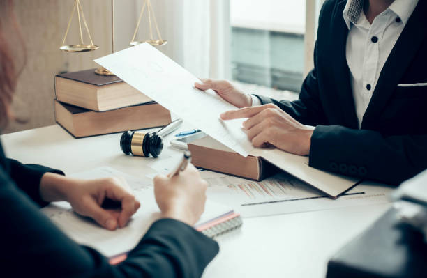 Businessman and lawyer discuss the contract document. Treaty of the law. Sign a contract business. stock photo
