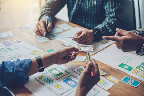 istock Team designers website and application meeting and planning together. 1287546540