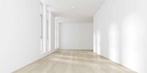 istock 3d render of modern empty room with wooden floor and large plain wall. 1287547601