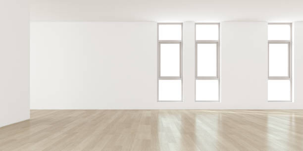 istock 3d render of modern empty room with wooden floor and large plain wall. 1287547610