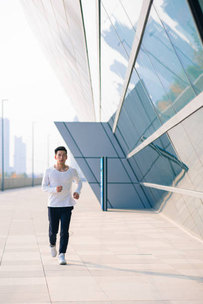 istock Man jogging in the city,For better health 1287547751