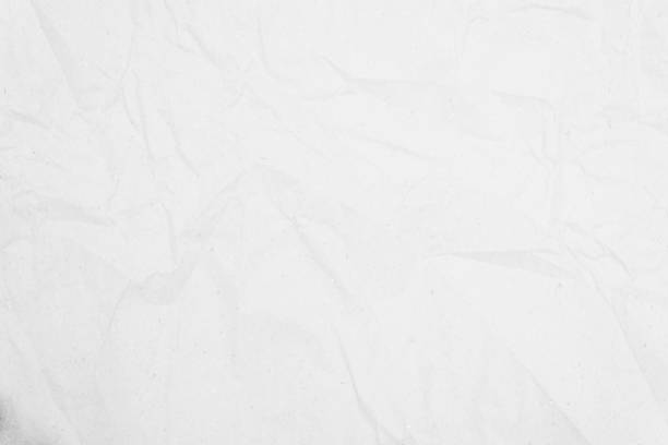 istock White recycled craft paper texture as background. Grey paper texture, Old vintage page or grunge vignette of old newspaper. Pattern rough art creased grunge letter. Hardboard with copy space for text. 1287549954