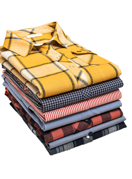 Stack of colorful lumberjack shirts isolated on white background Stack of colorful lumberjack shirts isolated on white background (with clipping path) colorful check shirts on sale at a clothing store stock pictures, royalty-free photos & images