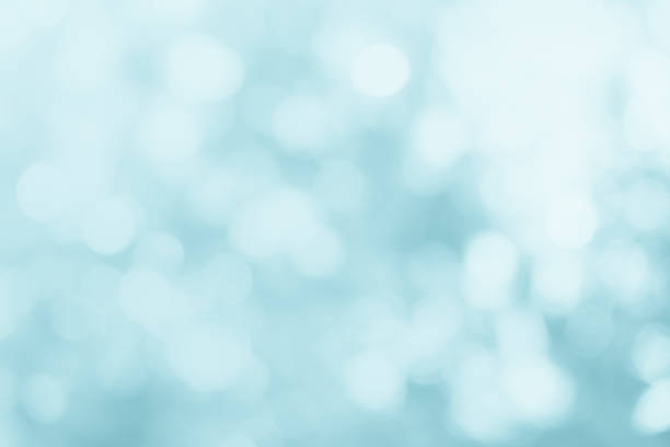 istock Natural spring blurred blue sea background. Create light soft blurred colors bright sunshine. Blue bokeh abstract glitter light background. Focus texture from nature fresh shiny growth seas the day. 1287550359