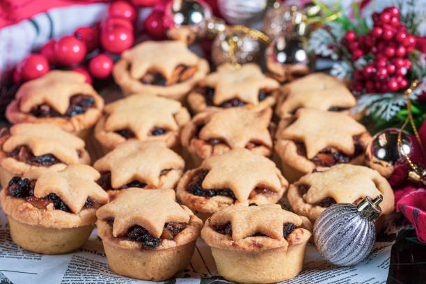 istock Many small round Christmas cupcakes with a star on top 1287550616