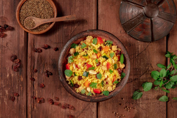 istock Moroccan couscous, overhead flatlay shot in a tagine with ingredients 1287551898