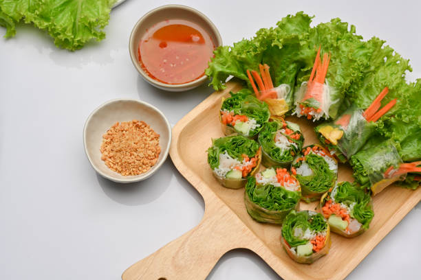 istock Asian appetiser, Vietnamese spring rolls served with dipping sauce in restaurant 1287555799