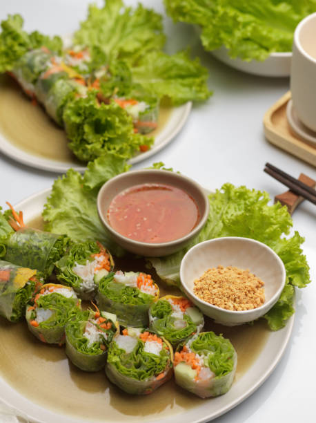 istock Vietnamese spring rolls with dipping sauce and vegetable on dinning table 1287555820