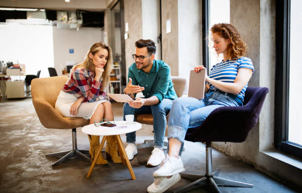 istock Successful group of designers, business people at work in office 1287556862