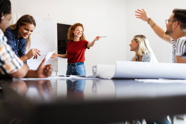 istock Successful group of designers, business people at work in office 1287556946