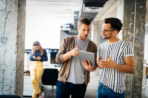 istock Successful company with happy employees in modern office 1287556992