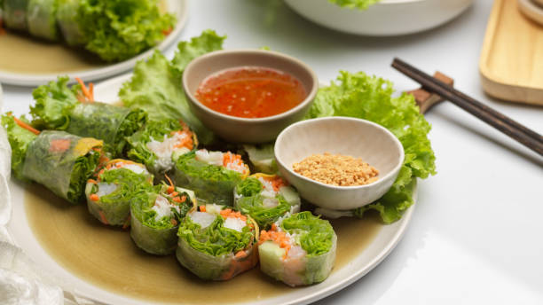 istock Asian appetiser, Vietnamese spring rolls served with dipping sauce on dinning table 1287557862