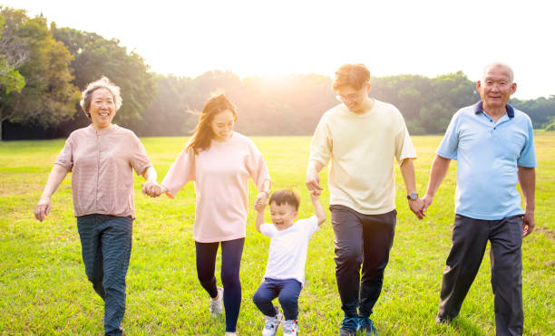 istock three generation asian family walking  in the park 1287558117