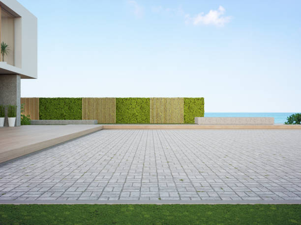 istock Beach house with empty cobblestone floor for car park. 1287559725