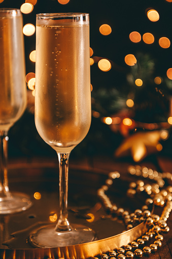 A glass of cold champagne in a Christmas atmosphere. High quality photo
