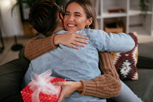 istock Boyfriend surprising his girlfriend with a gift. 1287561671