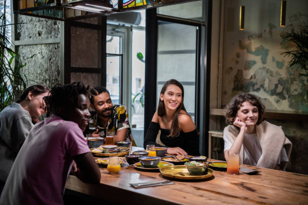 istock Multi-ethnic group of friends having a good time in a cafe 1287562416