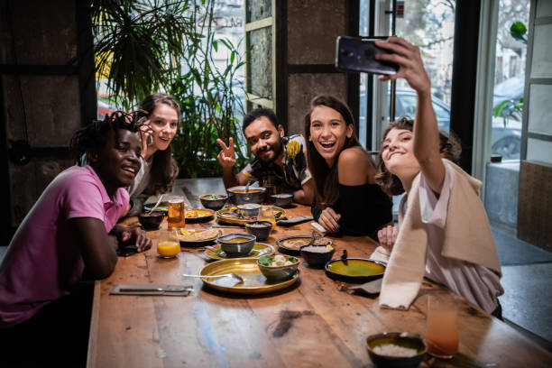 istock Friends taking selfies in a cafe during a dinner party 1287562940