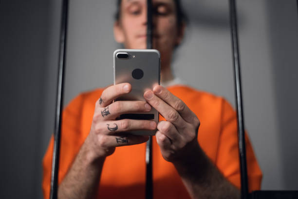 istock The criminal in the prison cell received a smartphone to communicate with relatives 1287563203