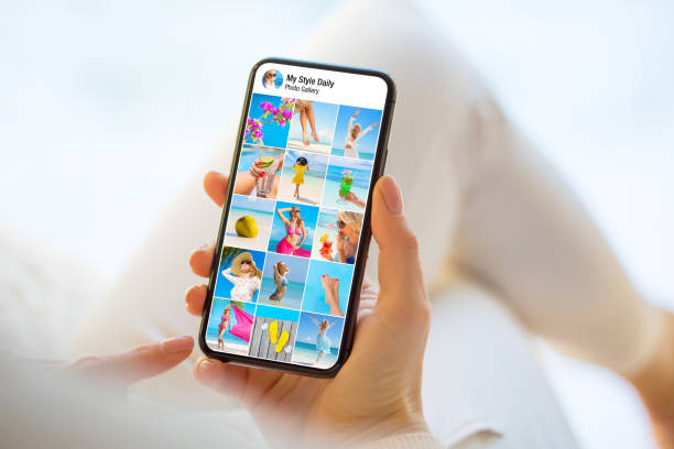 istock Person's photo gallery shown on mobile phone 1287563805