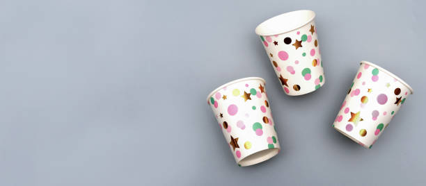 istock festive recycled paper cups on grey background. 1287566128