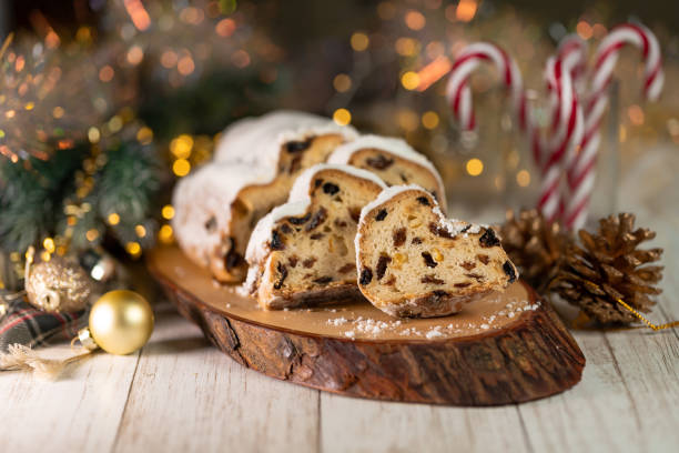 istock Christmas stollen on wooden background. 1287566585