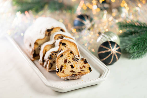 istock Christmas stollen on wooden background. 1287566611