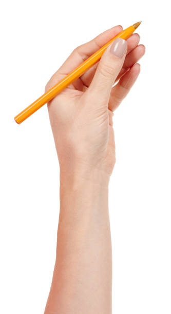 istock Hand with yellow writing pen isolated on white background. 1287569701