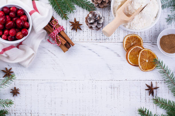 istock Bakery background with ingredients for cooking Christmas baking. Flour, brown sugar, cranberry and spices top view. 1287570182