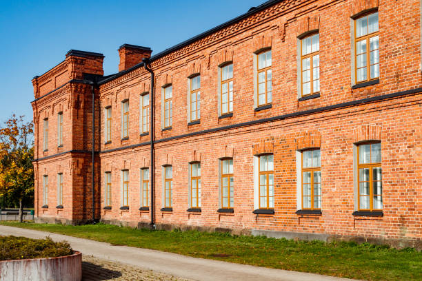 istock Beautiful vintage red brick building at sunny day 1287572713