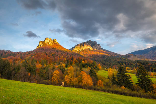 istock Autumn rural landscape with mountains peaks on background. 1287574808