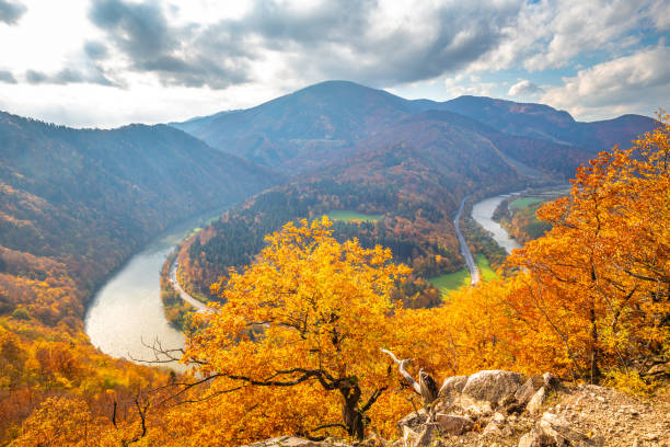 istock Autumn landscape with meander of a river. 1287574823