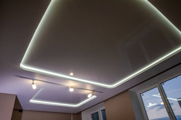 istock Beautiful stretch ceiling with led lighting. Two squares and lights 1287576394