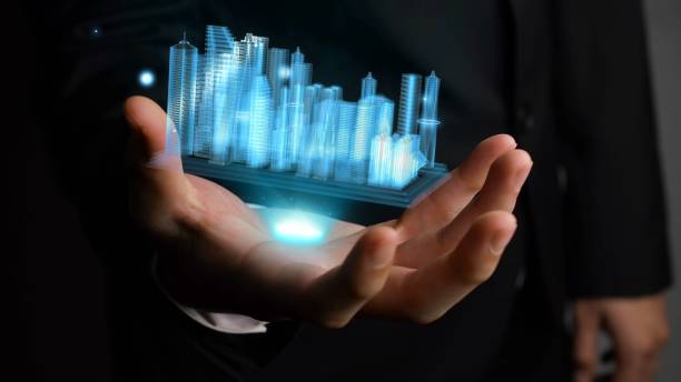 istock Businessman holds 3D city model showing augmented reality technology 1287576516
