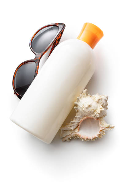 Summer: Suntan Lotion, Seashell and Sunglasses Isolated Suntan Lotion, Seashell and Sunglasses Isolated. More summertime photos can be found in my portfolio. Please have a look flip flop sandal beach isolated stock pictures, royalty-free photos & images