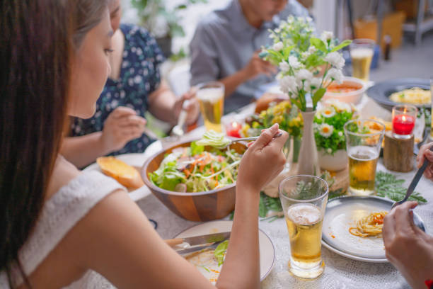 istock Group of Asian friends having dinner in a restaurant. 1287579459