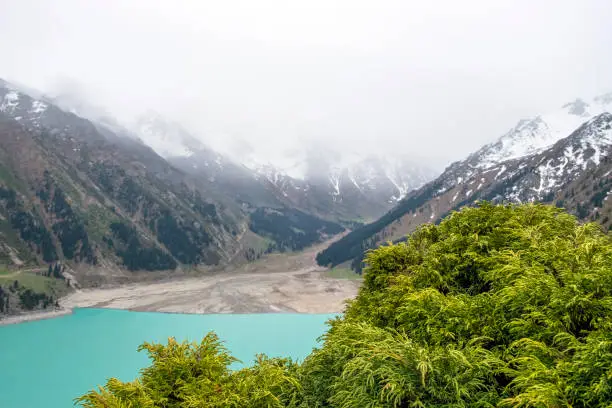 Photo of Beautiful landscape of blue lake in the mountains. Big Almaty Lake in the spring.