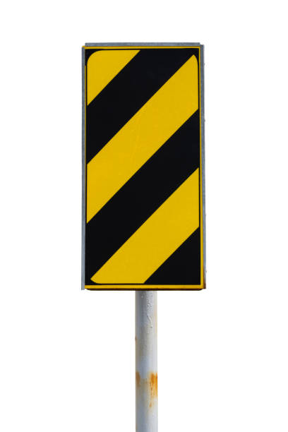 istock Yellow and black warning or safety sign with reflective surface isolated on white background. 1287579930