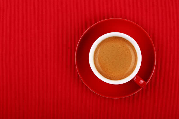 istock Cup of espresso coffee on red saucer 1287581551