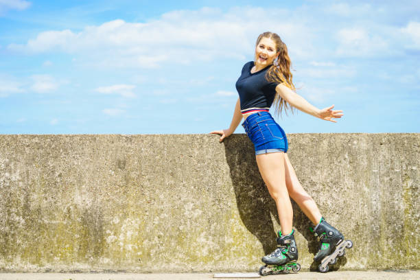 istock Fit girl with roller skates outdoor 1287585306