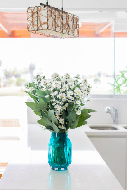istock Cute flower arrangement in a home kitchen 1287585904