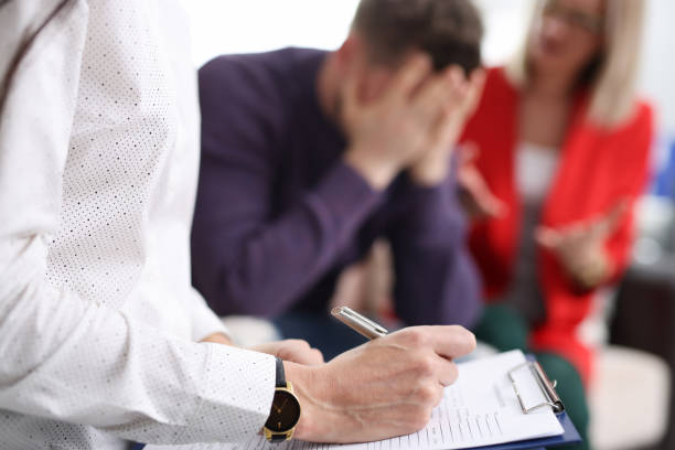 istock Married couple at psychologist's a appointment closeup 1287586939