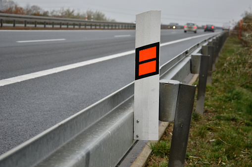 symbol, information, sign, road, autumn, arborescens, caragana, bush, safety, safe, disaster, sos, highway, telephone, 10, km, attached, plastic, orange, white, reflective, reflector, crash, absorb, energy, zone, deformation, asphalt, czech, traffic, protection, barrier, metal, steel, side, border, prevent, vehicle, dividing, bumper, anodized, barricade, transportation, roadway, street, fence, galvanized, guardrail, roadside, construction, accident, car, emergency, police, hide, cover, repair, car, maintenance, quality, control, lawn, ditch,